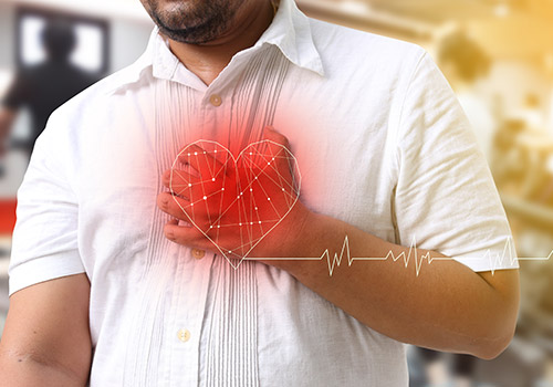 man holding chest with location of the heart shown