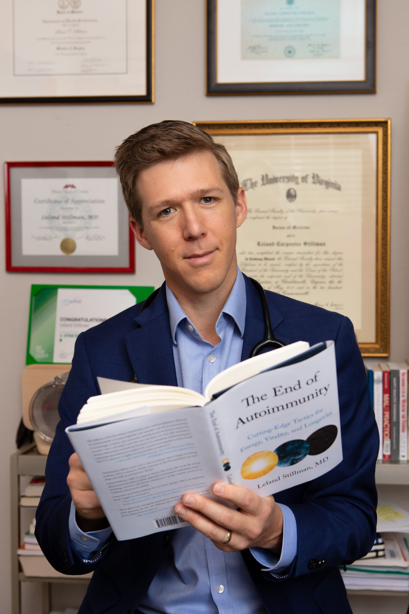 Dr. Leland Stillman holding The End of Autoimmunity book